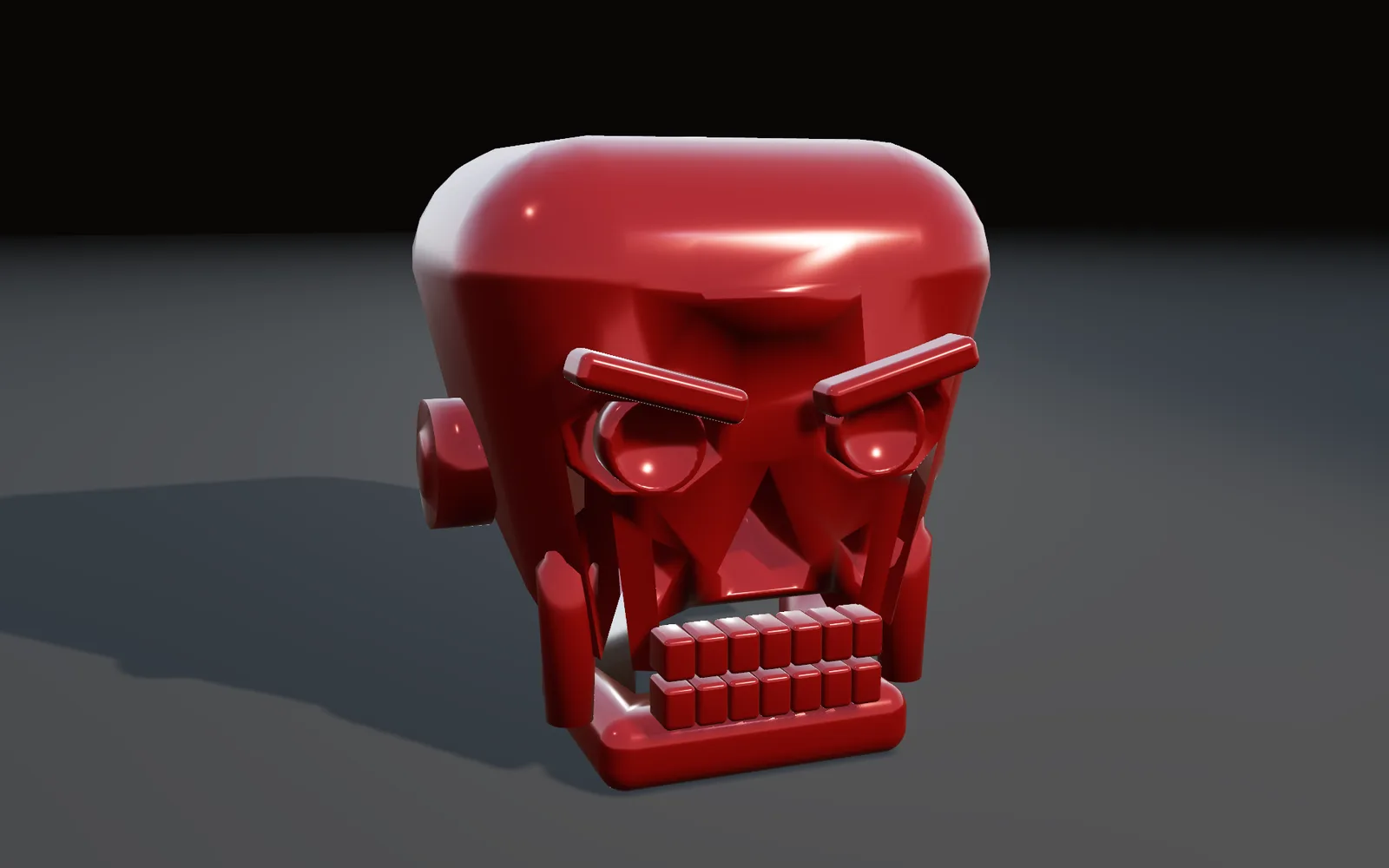 A glossy red skull