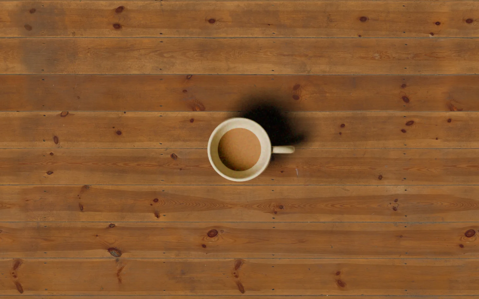 a cut-out cup set onto wooden boards, rim cleaned and grain matched