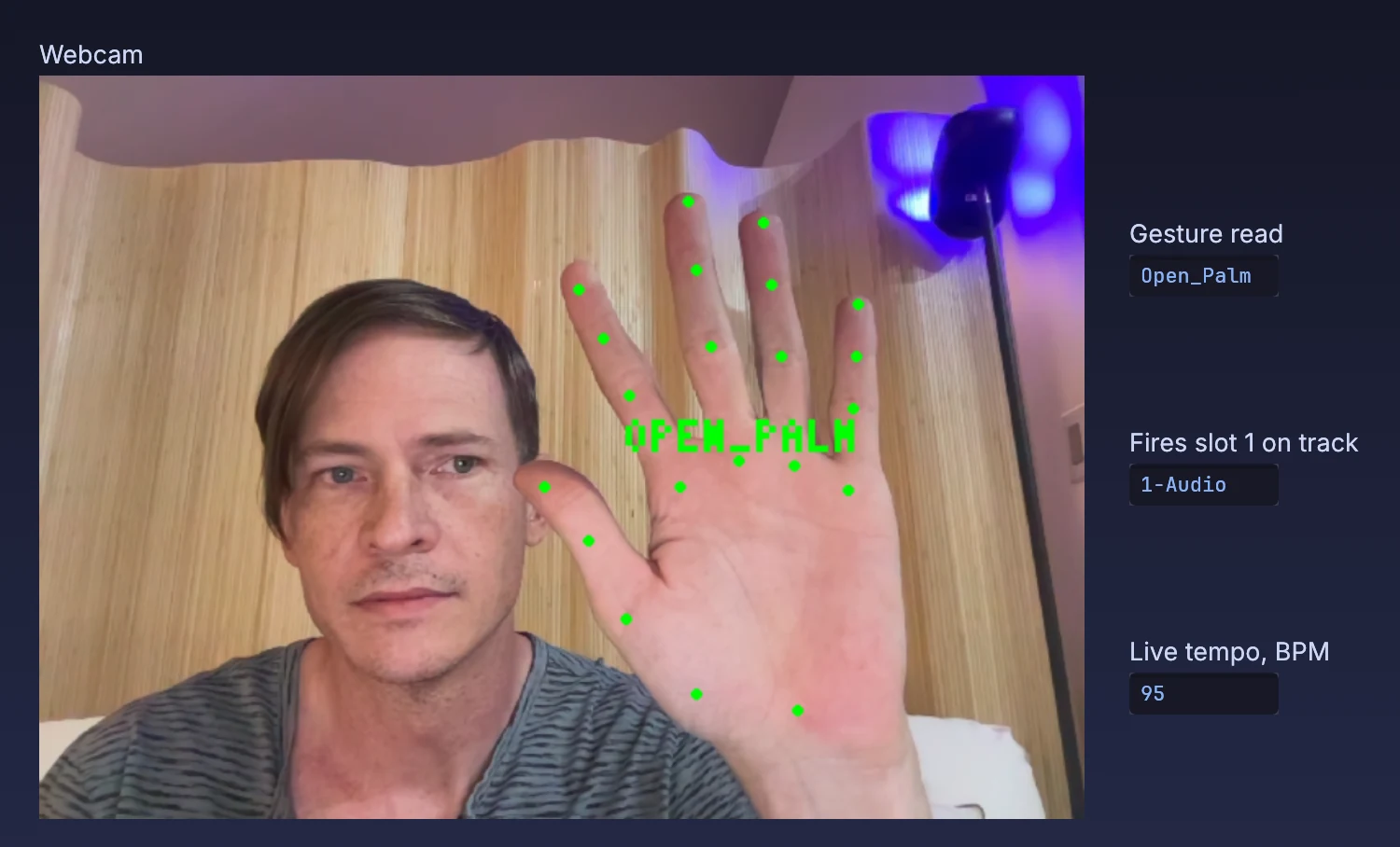 an open palm read from the webcam; the panel shows the Live track it fires a clip slot on and Live's tempo, both read from Live