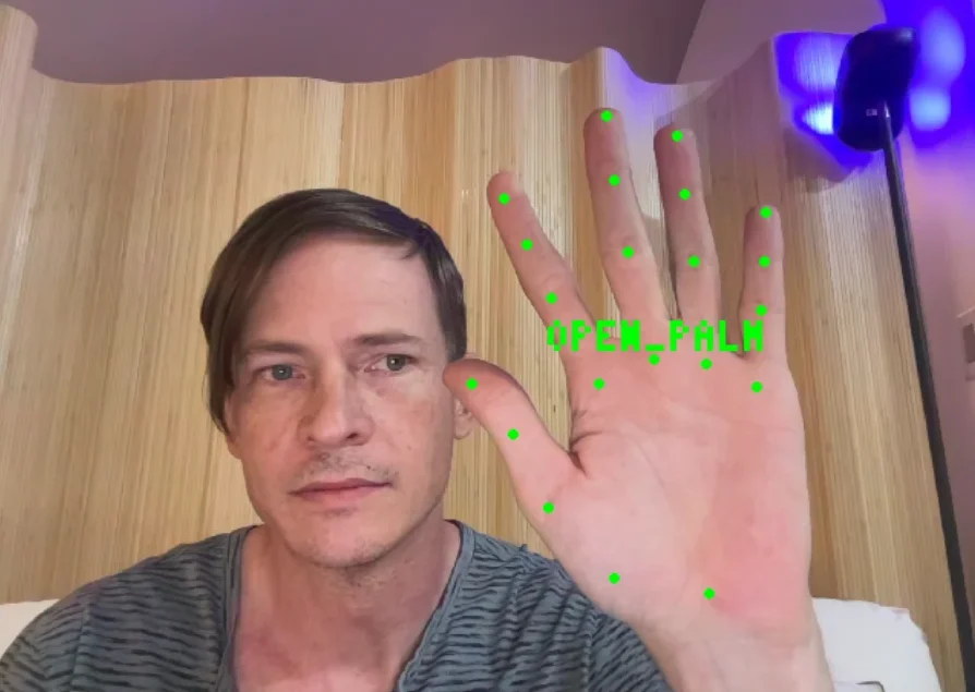 an open palm read from a webcam, ready to fire a cue