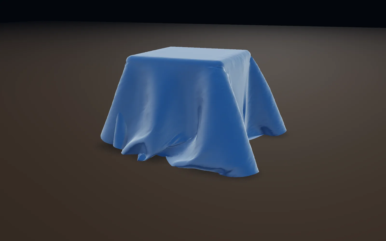 A round blue cloth settled over a box in soft folds