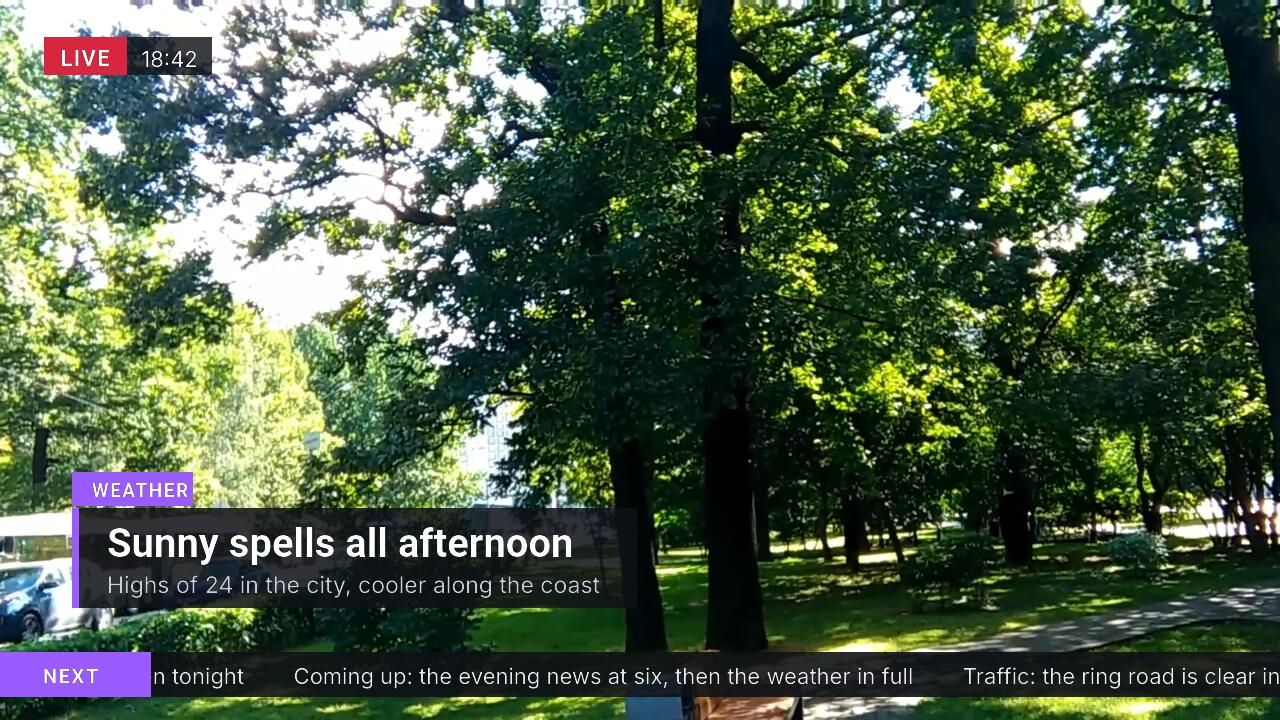 A camera shot of a park with a LIVE bug and a clock, a weather lower third that wipes in and out, and a news crawl along the bottom