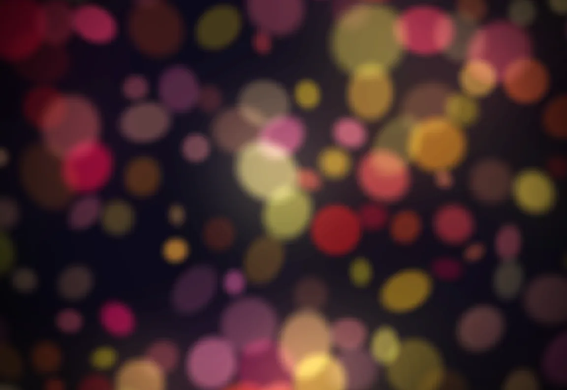 Soft circles of warm light over a dark field, pushed in by a loud beat of the song.